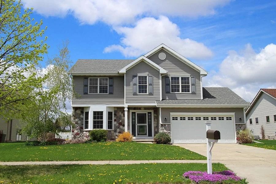 A two-story house on a residential street